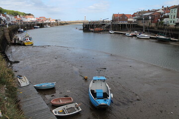 Whitby North Yorkshire UK 21st August 21 2024 Whitby a British seaside town  with boats moored in the harbour on a  hot summers