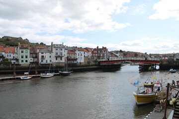 Whitby North Yorkshire UK 21st August 21 2024 Whitby a British seaside town  with boats moored in the harbour on a  hot summers