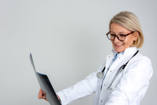 female doctor analyzing mri image of lower spine from patient
