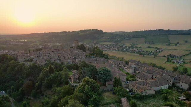 Sunset illuminating picturesque mediaeval italian village Castellarquato