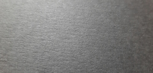abstract dark grey paper texture, close-up textured surface, beautiful background and wallpaper with space for design