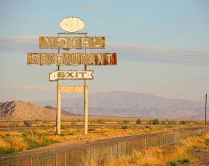 Abandoned motel restaurant exit highway neon billboard sign