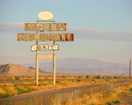 Abandoned motel restaurant exit highway neon billboard sign
