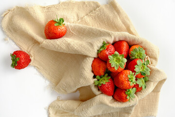 red ripe strawberries on a white background