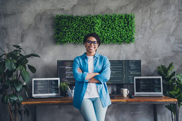 Photo of attractive woman confident posing boss crossed hands wear blue shirt modern office...