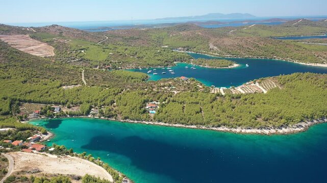 The aerial view of Vira Bay and Jagodna Bay, secluded coves near Hvar, Croatia, located along the stunning Adriatic Sea in Europe. These picturesque bays showcase the crystal-clear blue waters.