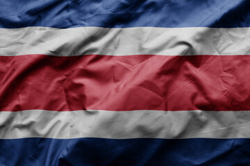 waving colorful realistic national flag of costa rica .