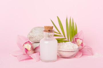 Composition with orchids, spa products on color background