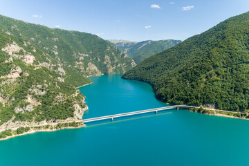 Aerial view of famous Piva Canyon with its fantastic reservoir