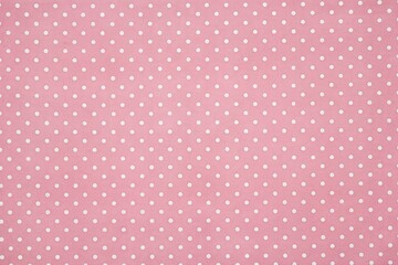 Soft pink background speckled with small white polka dots, creating a playful and whimsical texture perfect for use in feminine and youthful design projects.