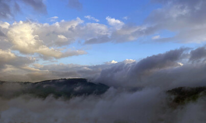Landscape of mountains and clouds in the blue sky, a natural background