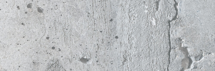 Texture of old cracked concrete wall. Rough gray concrete surface. Great for background and design. Close-up. High resolution.
