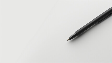 Black Ink Pen Laid Diagonally on a Blank White Surface for Creative Writing Sessions