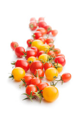 Different colorful cherry tomatoes isolated on white background.