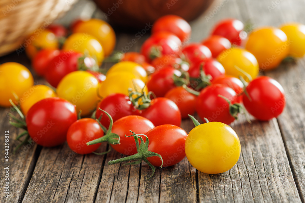 Canvas Prints different colorful cherry tomatoes on wooden table.