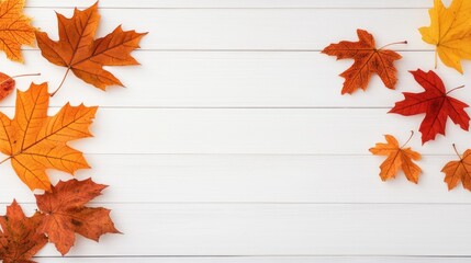 Vibrant autumn maple leaves are laid out on a white wooden table, leaving plenty of space for adding text or designs