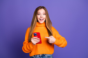 Photo of youngster girl enjoying experience using this pointing smartphone bought with discount...