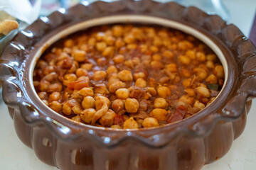 A bowl of Chana masala a hearty chickpea, spiced tomato sauce.