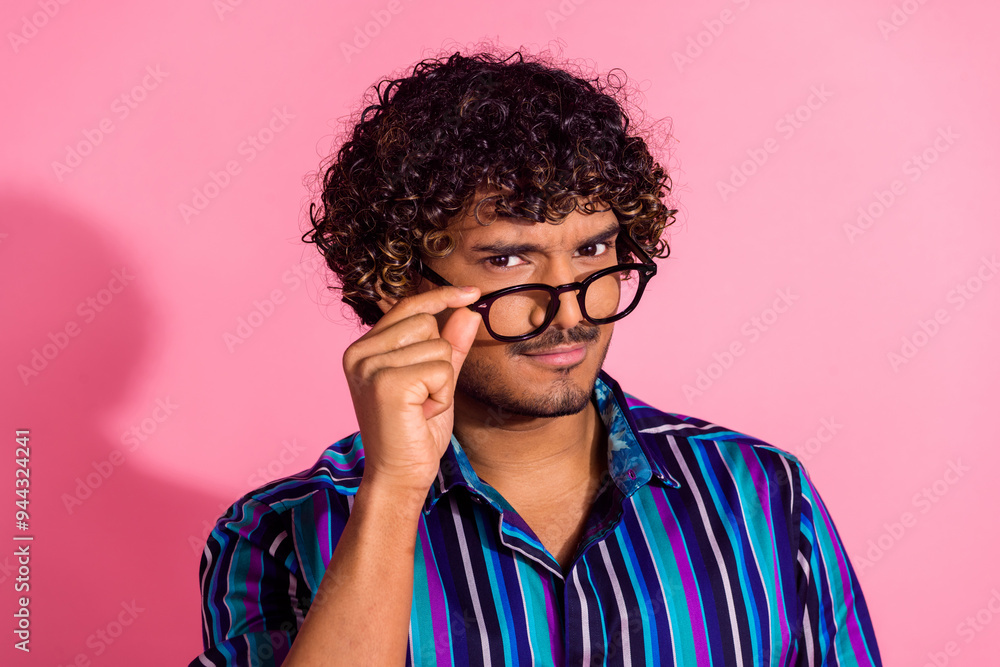 Poster Photo of nice young man touch eyeglasses think wear shirt isolated on pink color background