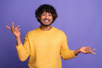 Photo of cheerful nice man wear trendy yellow clothes tell news isolated on violet color background