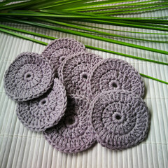 Washable, grey crocheted round cosmetic pads for a sustainable zero-waste bathroom