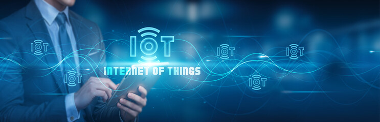 Hand holding a tablet with a global network connection, symbolizing the Internet of Things (IoT), advanced technology, and a futuristic digital world, enhancing connectivity .