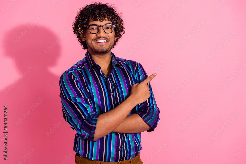 Poster Photo of nice young man direct finger empty space wear shirt isolated on pink color background