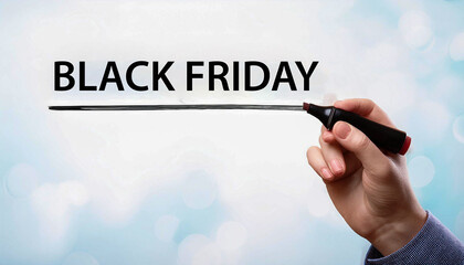 Woman's hand writing Black Friday in black marker on transparent wipe board. On white background