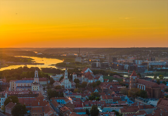 Kaunas old town, Lithuania. Panoramic drone aerial view photo of Kaunas city center with many churches and other historical building. Evening sunset