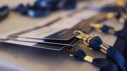 Process of checking in on a conference congress forum event, registration desk table, visitors and attendees receiving a name badge and entrance wristband bracelet and register electronic ticket