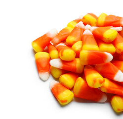 Tasty Halloween candy corns on white background, closeup