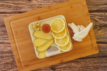Ginger, Lemon, Honey, Tea, & Thermometer Preparing For The Cold And Flu Season
