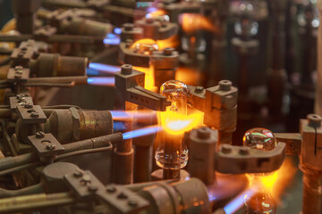Processing line of light bulb factory with special equipment for working with hot melting glass...