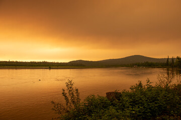Forest Fire Smokey Skies in Alaska over a River