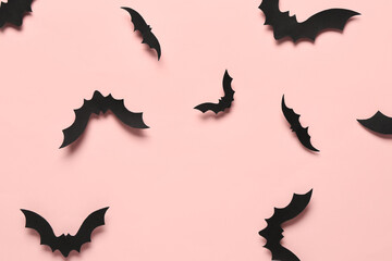 Paper bats for Halloween party on pink background