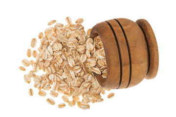 Oat flakes in wooden bowl isolated on white background with full depth of field. Top view. Flat lay