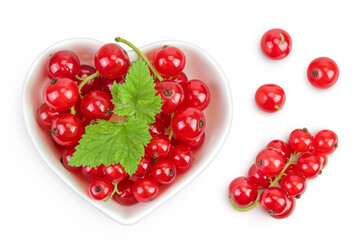 Red currant berries in a ceramic bowl with leaf isolated on white background. Top view. Flat lay