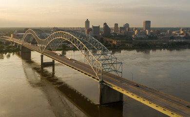 Hernando de Soto Bridge crossing the Mississippi River at sunrise. In the background is downtown Memphis, Tennessee, United States.