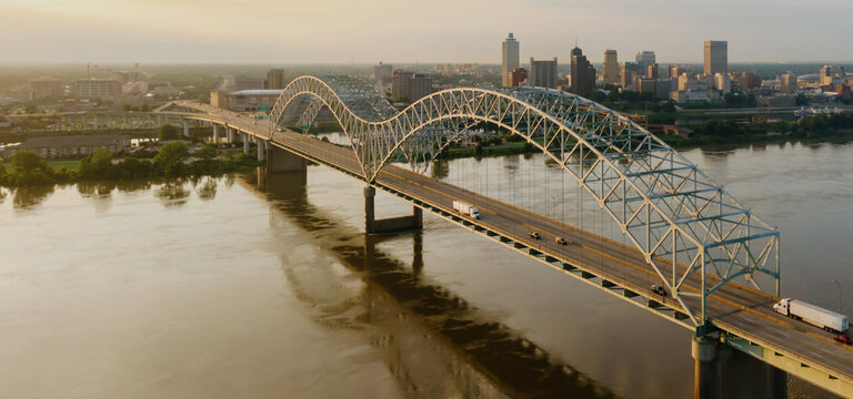 Hernando de Soto Bridge crossing the Mississippi River at sunrise. In the background is downtown Memphis, Tennessee, United States.
