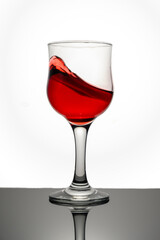 Red wine pouring in glass