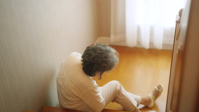 Asian senior woman fell down the stairs during suffering from heart attack. Elderly woman feeling pain on chest area and difficulty breathing. Emergency medical healthcare and health insurance concept