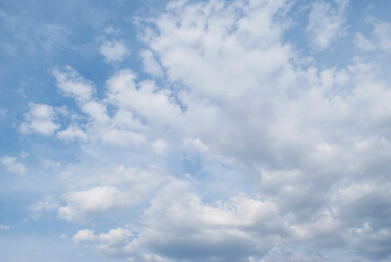 gentle white clouds in the blue sky