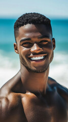 Smiling handsome black man on the beach