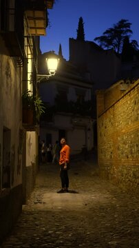 tourist waliking in the albacin granada spain at night