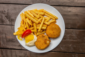 Czech meal - fried hermelin (camembert-type cheese) wih french fries and tartar sauce