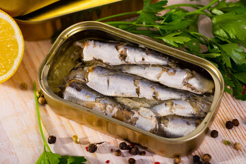 Tin can with smoked sprats, sardines, closeup. High quality photo © JackF