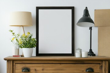 A vintage frame sits above a wooden dresser in a warm living room, complemented by natural decorations like indoor plants and textured walls that enhance the cozy atmosphere. Mockup