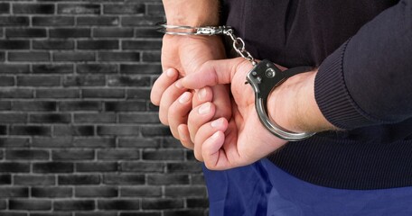 Businessman person hands in handcuffs arrested