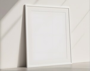 White vertical frame mockup hanging on a white wall 