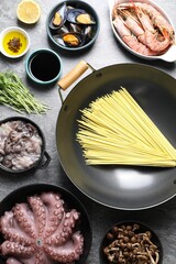 Ingredients for wok on grey table, flat lay
